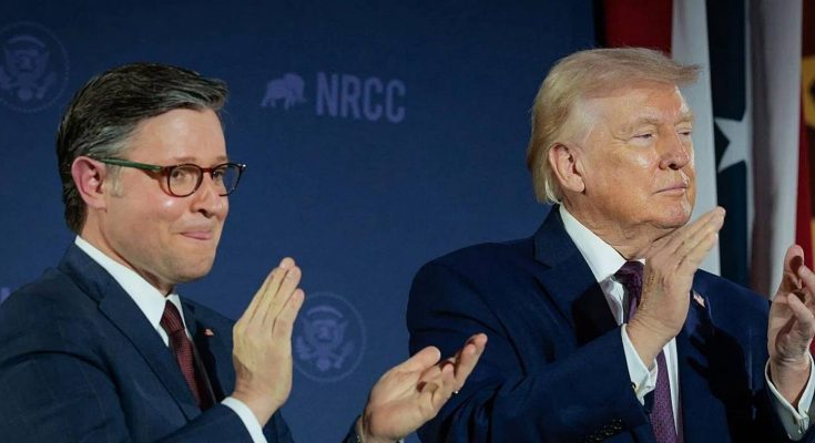 Two men in suits clapping at a political event with NRCC branding in the background